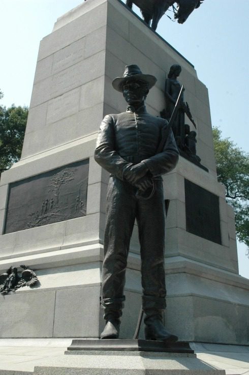 Statue of a soldier at a monument.