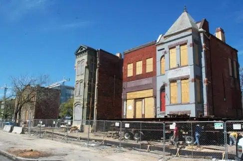 Historic buildings on trucks for relocation.