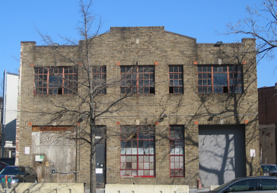 stone brick building with large windows